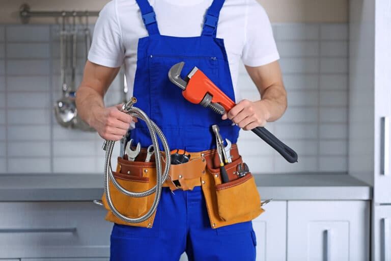 plumber holding tools