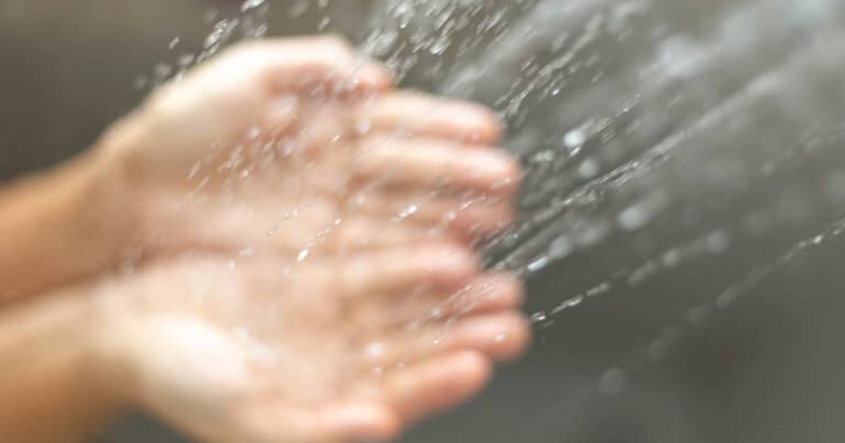 water poured into hands Photo By Anderson Coelho at istock
