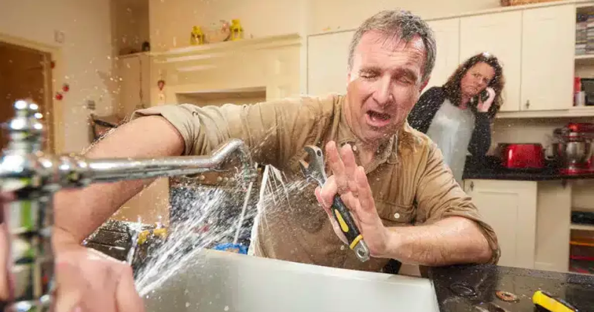 Leaking faucet running all over man stock photo by sturti at istock